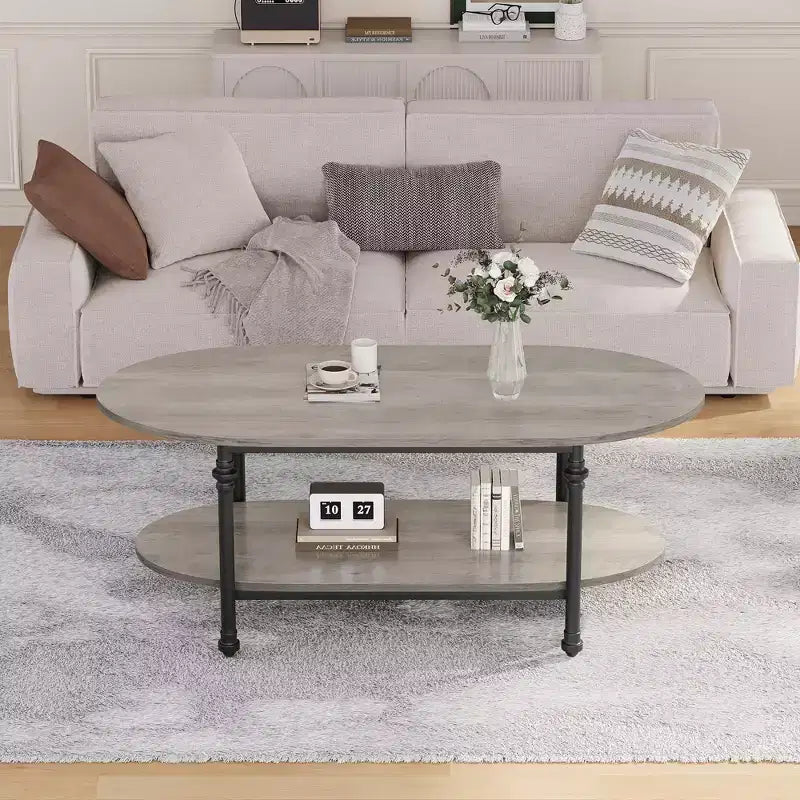 Tavolino ovale grigio/marrone con 2 ripiani e base a 4 gambe